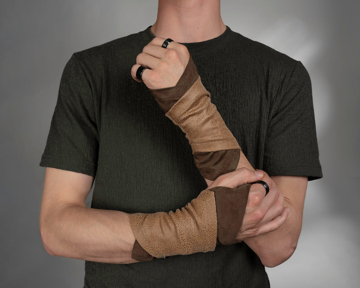 Man raising one arm in tan and brown faux suede fingerless gloves, front view – ZOLNAR