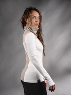 Side profile of white and beige futuristic sweater with black trousers – ZOLNAR