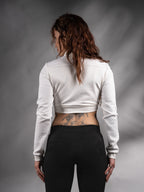 Back view of white cropped sweater with textured sleeves – ZOLNAR