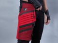 Red waterproof thigh bag holster with zipped pocket worn on leg, techwear – ZOLNAR