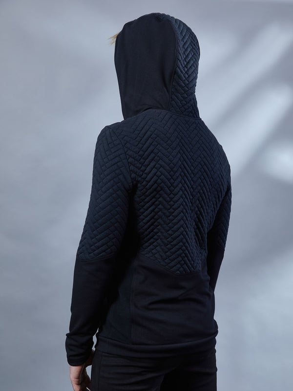 men in a black hoodie from behind